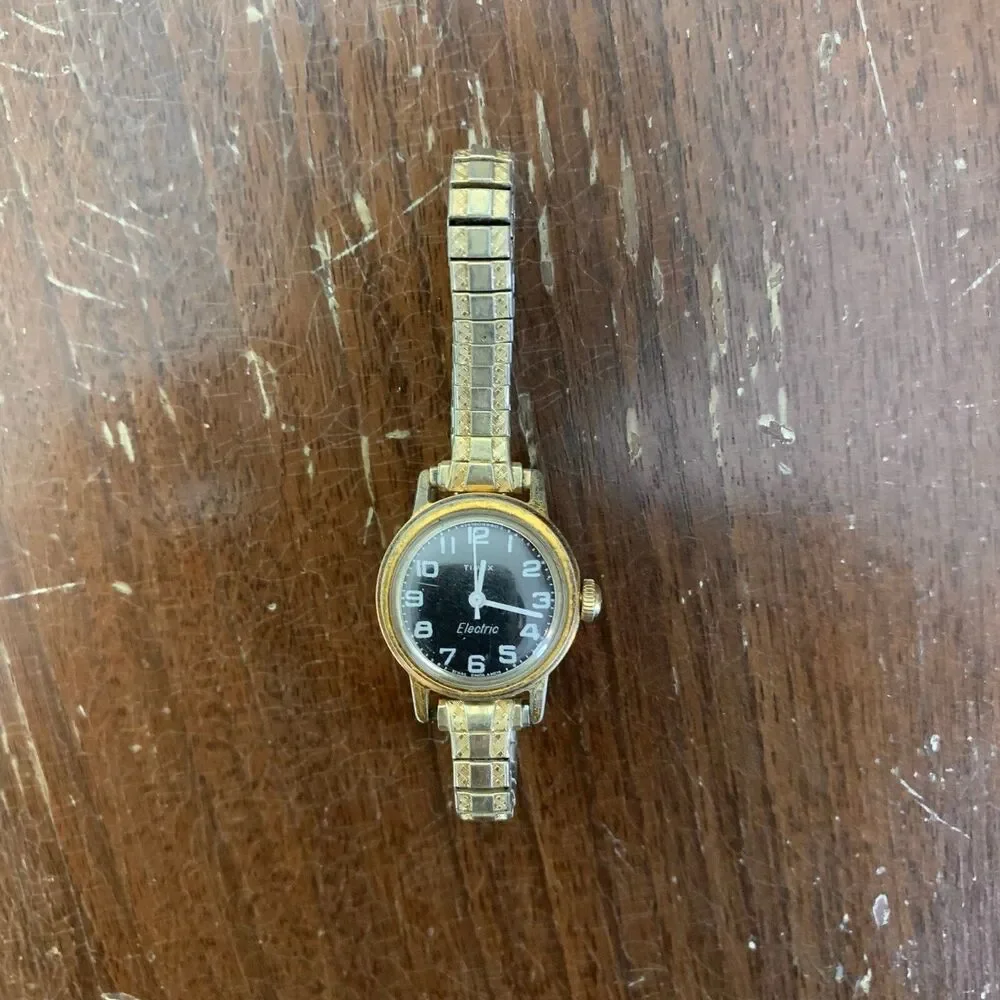Vintage Women's Gold Timex Electric Analog Black‎ Face Speidel band Wrist Watch